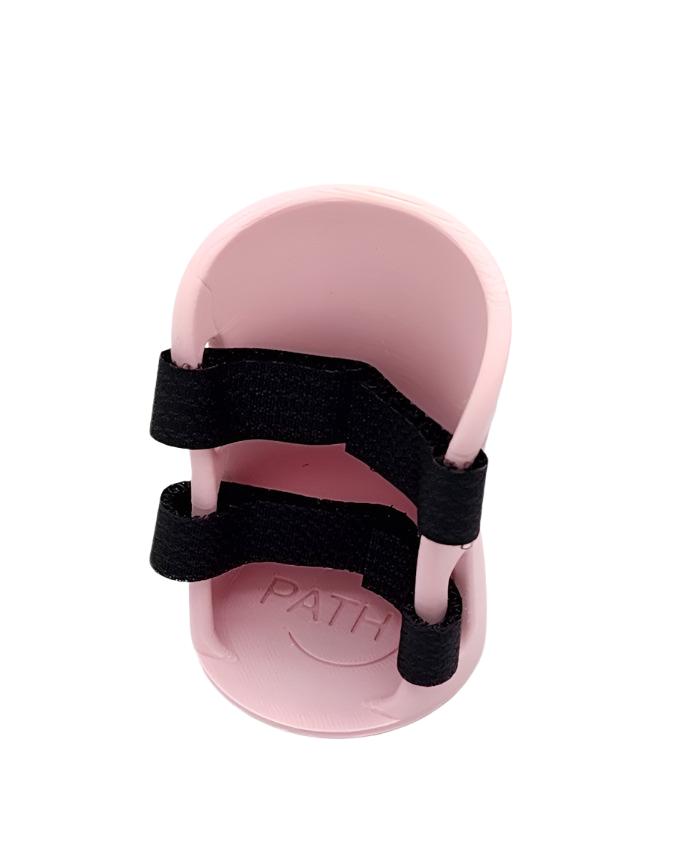 Large pink toy brace on white background